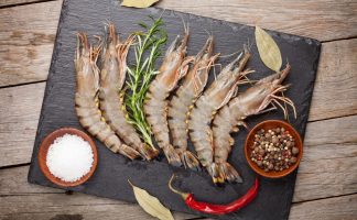 Fresh raw tiger prawns and spices